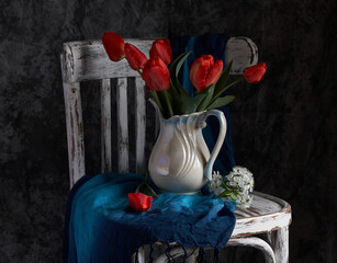 Red tulips bouquet in white vase on vintage cher. Valentine Day, Mothers day, birthday concept. © Igor Syrbu