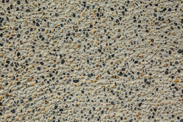 texture of small stones on a white background on a sunny day