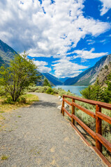 Beautiful landscape of valley in Alpine mountains, small trail, hike root, majestic picturesque view in sunny day. Lillooet Setaon Lake. Vancouver. British Columbia. Canada.