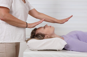 Obraz na płótnie Canvas Reiki healing treatment . Energy therapy, alternative medicine concept.