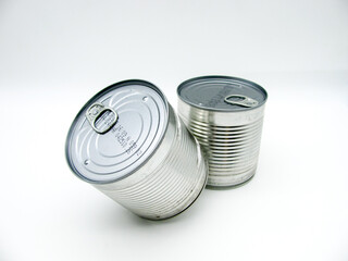 Two closed tin cans on a white background.