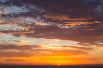 Fototapeta na wymiar sunrise over the mediterranean sea and colorful clouds