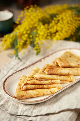 Assorted Russian pancakes with different fillings: red caviar, salmon, meat, chocolate