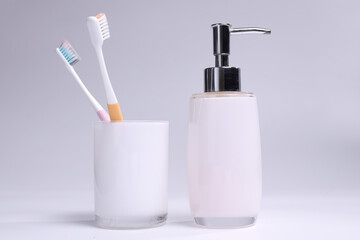toothbrush and toothpaste on white background