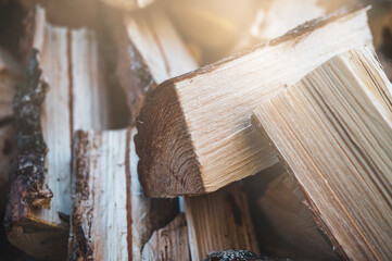 Wooden natural sawn logs as background. Wood texture. Firewood close up. Pine wood.