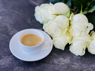 white roses and a cup of espresso