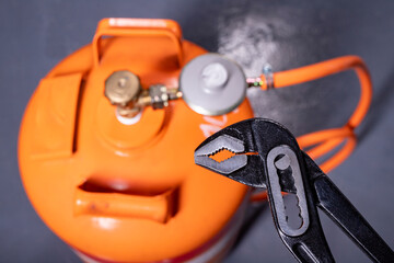 Installation of the reducer to the gas cylinder. Installation work on the gas installation.
