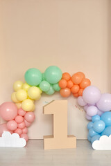 Fototapeta na wymiar first birthday decorations baloons digit one interior
