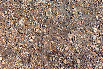Embankment road made of small stones.