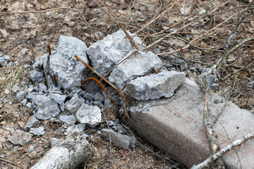 A closeup photo of concrete broken pillar with rusty rods