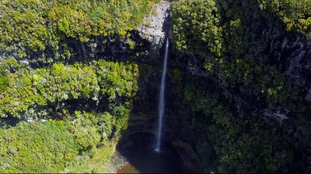 Aerial view of Risco Waterfall, Raba&ccedil;al, Paul da Serra, Central Madeira. The waterfall is inside a subtropical rainforest. These laurisilva forests are designated as a World Heritage Site by UNESCO