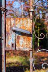 Old and rusty door handle of a garden