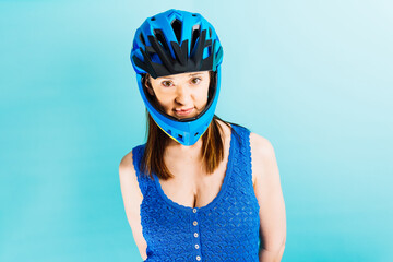concept Beautiful young woman looking forward with full face trial or downhill helmet women and...