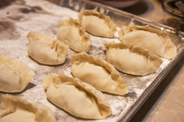 Fototapeta na wymiar Homemade Dumplings Waiting To Be Cooked