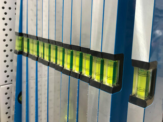 metal level for repair. a level with liquid in order to evenly apply the mortar or hang a picture. metal tools for builder work