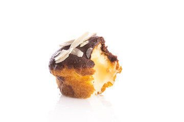 French eclairs or sweet Italian profiteroles isolated on white background