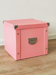 pink folding storage box made of durable cardboard for storing papers, documents, various items