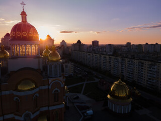 Aerial view from a drone to the sunset over the city of Kiev on Obolon embankment