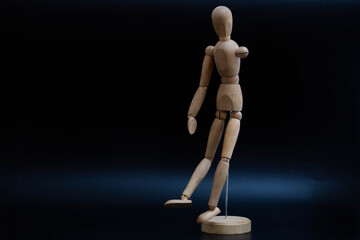 poses of a wooden man for drawing on a black background