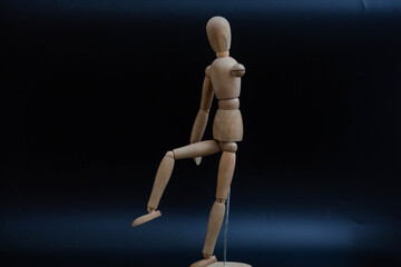 poses of a wooden man for drawing on a black background