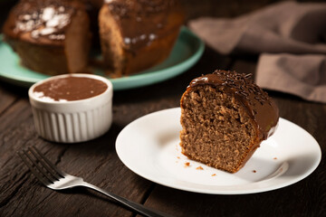 Homemade chocolate cake with chocolate sauce topping.