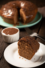 Homemade chocolate cake with chocolate sauce topping.