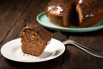 Homemade chocolate cake with chocolate sauce topping.