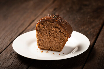 Homemade chocolate cake with chocolate sauce topping.