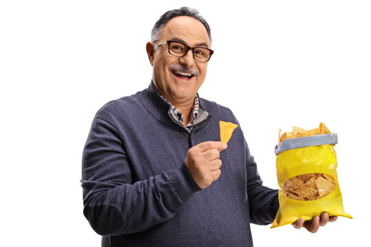 Cheerful Mature Man Holding A Pack Of Tortilla Chips