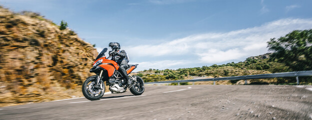 motorbike on the road riding. having fun driving the empty highway on a motorcycle tour journey