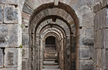 Fototapeta na wymiar Pergamon, Turkey - a well preserved site from ancient Greek and Roman period, Pergamon is a Unesco World Heritage. Here in particular a glimpse of the archeological area . domed corridors and doors 