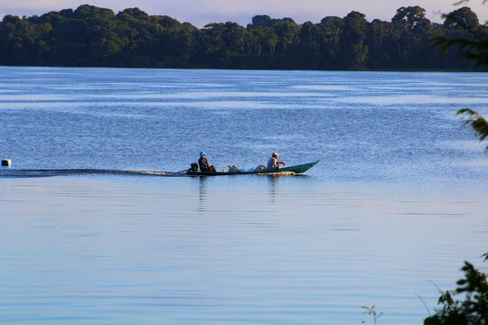 Small ribeirinho motor boat (voadeira) on the Rio Negro's waters.