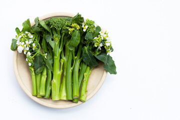 Green baby broccoli with chinese kale floweron white background.
