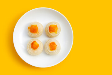 Chinese pastry on yellow background.
