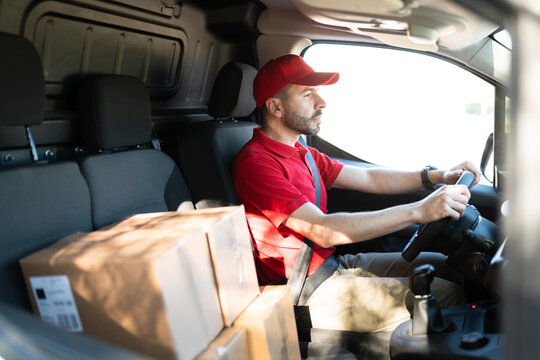 Delivery driver working to deliver parcels in a truck