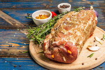 Raw pork roll stuffed with garlic and carrots