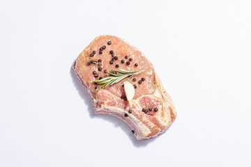 Raw pork loin steak isolated on white background