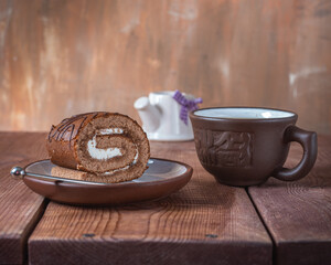 Sweet lunch with stuffed roll and zeo tea in a clay mug