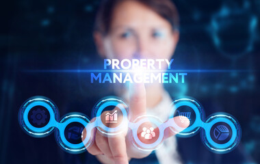 Business, Technology, Internet and network concept. Young businessman working on a virtual screen of the future and sees the inscription: Property management