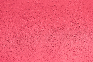 pink water drops on a window