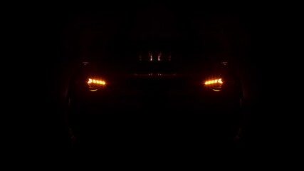Car headlight blinking in Dark. Sports car Headlight. Switching of car LED headlights in night