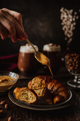 Croissant with peanut butter and hot cacao
