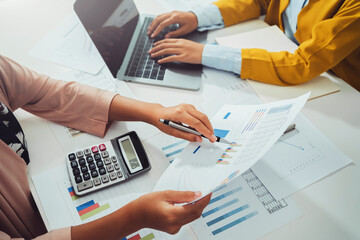 close up hand accountant holding pen pointing on paperwork chart for meeting team in office room....