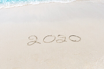 Happy New Year 2020 is coming concept sandy tropical ocean beach