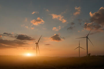 Fototapeta na wymiar Silhouette of wind turbines at sunset.