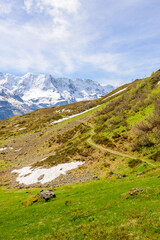 Fototapeta na wymiar Crossing the Alps. Hiking trail in the Alps.