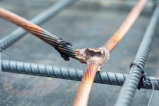 Welding copper ground wire on ground rod.Welding copper ground wire.Connect copper grounding lightning protection system. With the melting