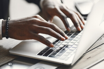 Man sitting at the computer and drinking coffee