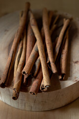cinnamon sticks on wooden background