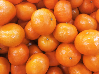 Top view. Fresh tangerines. Ripe and tasty mandarins. Clementines. Background tangerines